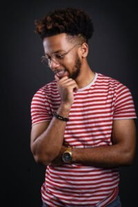 photo of a man wearing a white and red striped crew neck t shirt