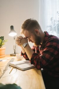 a bearded man praying