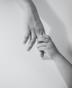 grayscale photo of to hands