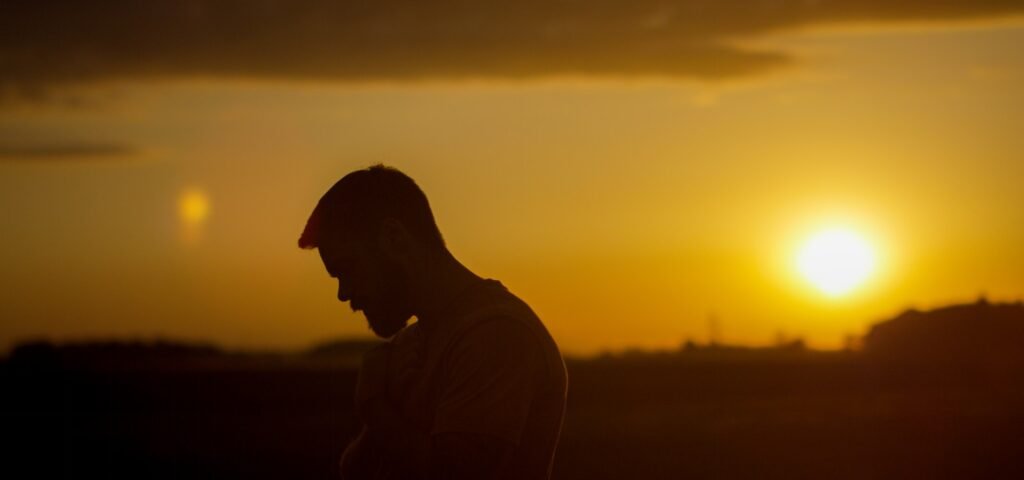 silhouette of man during sunset